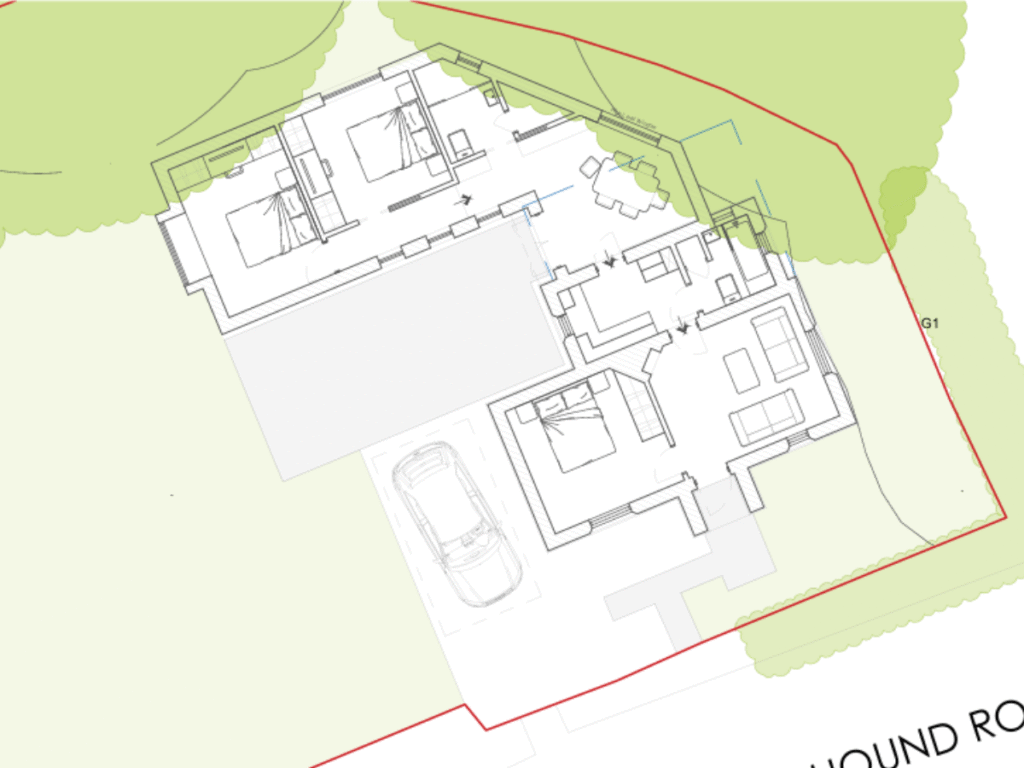 Proposed site plan of the gate lodge extension in Netley Abbey, showing a new wing with two bedrooms, a dining area and a shower room linked to the original lodge, around a patio, with parking off Hound Road and woodland along the boundary.